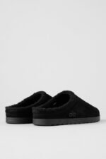 Alo Recovery Slipper in the black suede color with a faux fur lining.  - Image 3